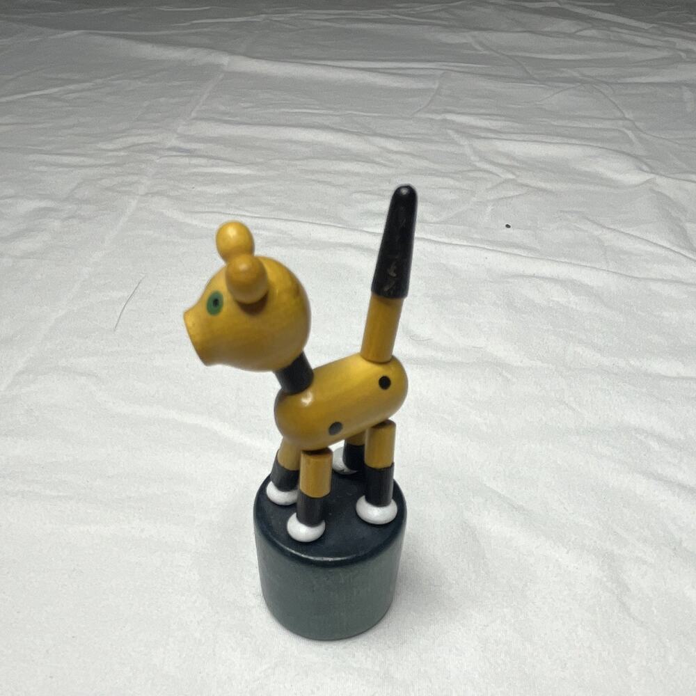Wooden Push Button Jumping Yellow Dog Animal Figure Toy on Round Base